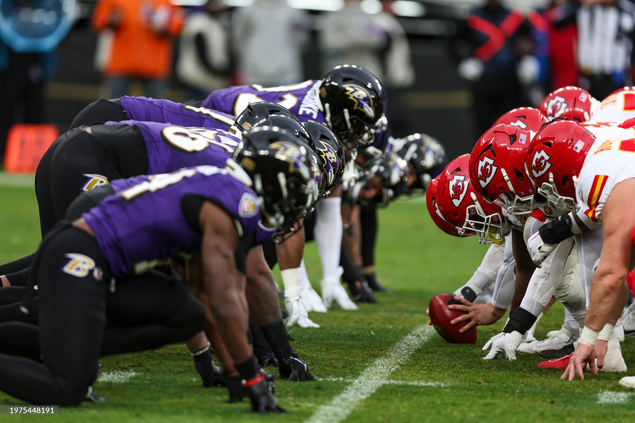Baltimore Ravens and Kansas City Chiefs linemen facing each other at the line of scrimmage