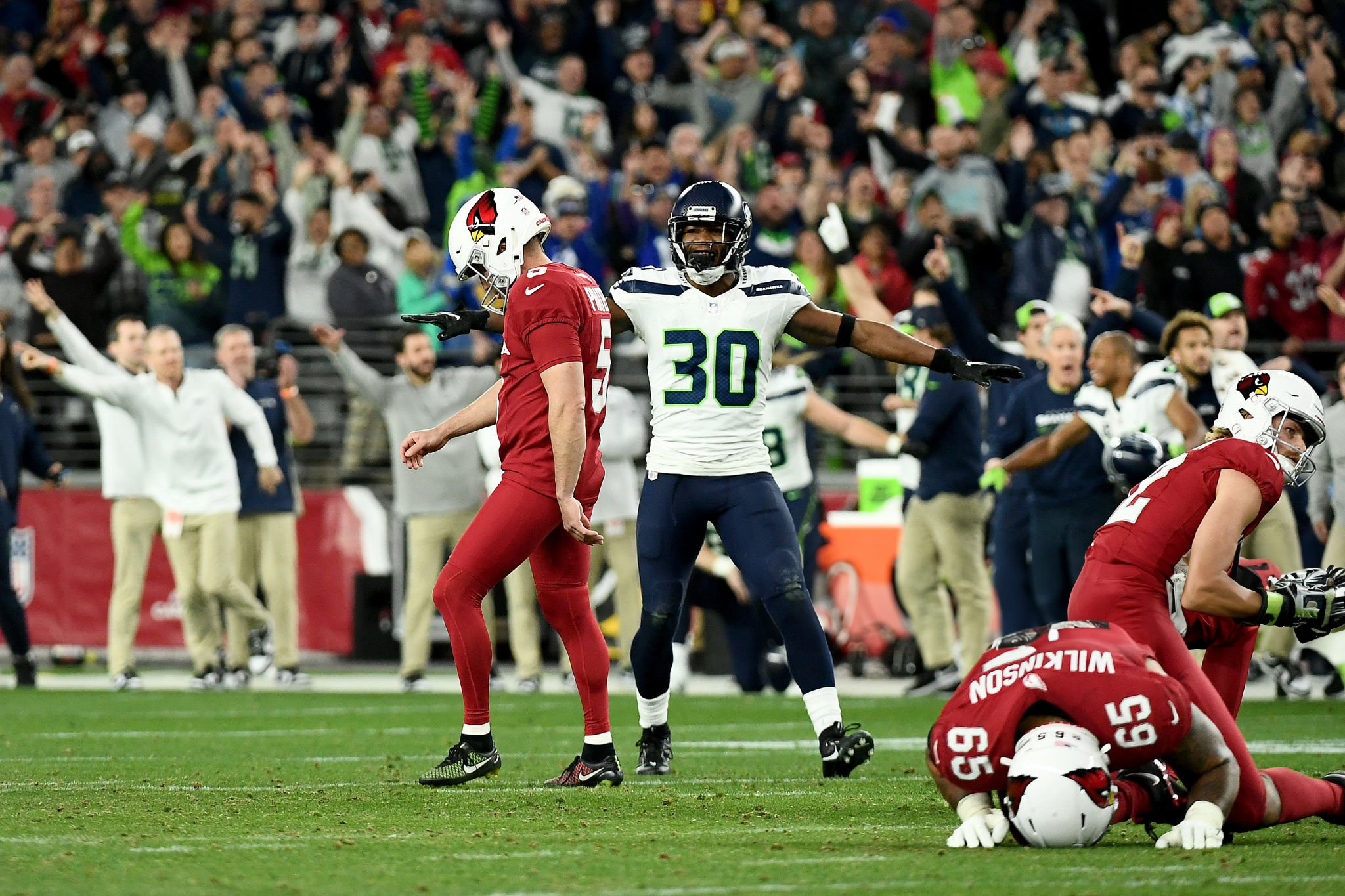 Seattle vs Arizona football featuring Matt Prater looking dejected